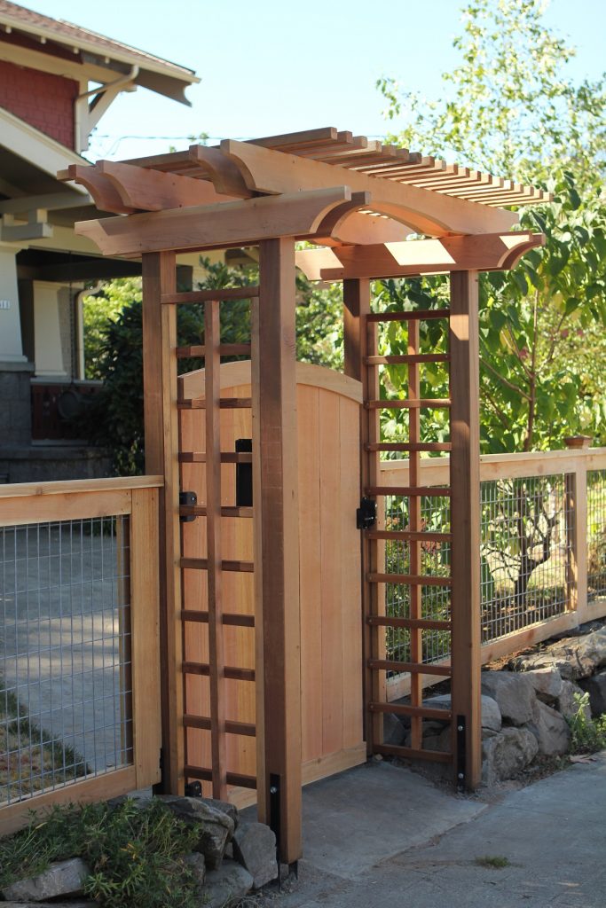 The Hoodoo Arbor creates a formal entryway for this Portland front yard gate