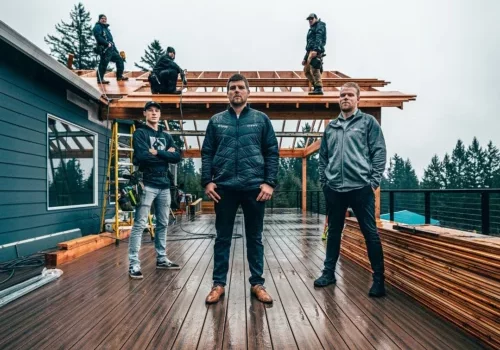 Cascade crew stands on a deck in construction
