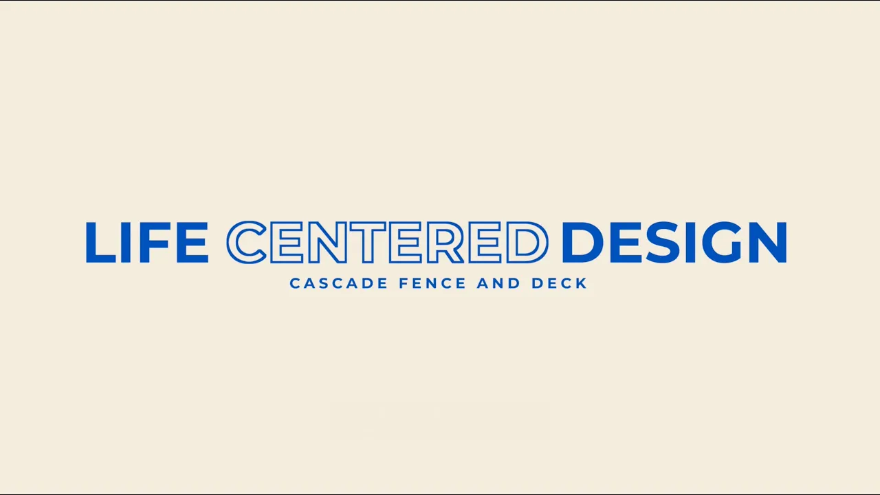 Text reads LIFE CENTERED DESIGN in large blue letters with CASCADE FENCE AND DECK in smaller blue text below, all on a light beige background.